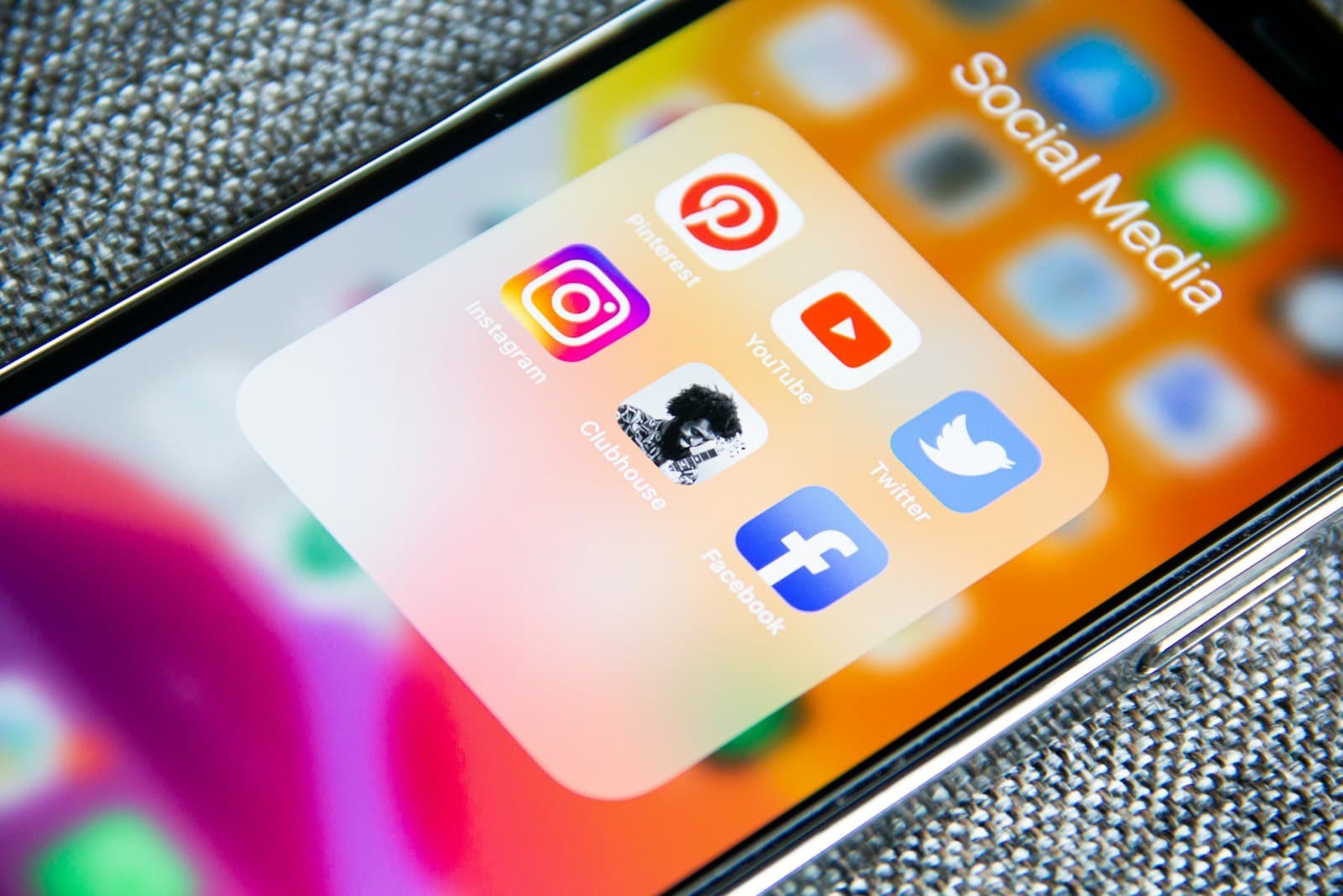 Phone screen showing social media apps — where your first ads will run