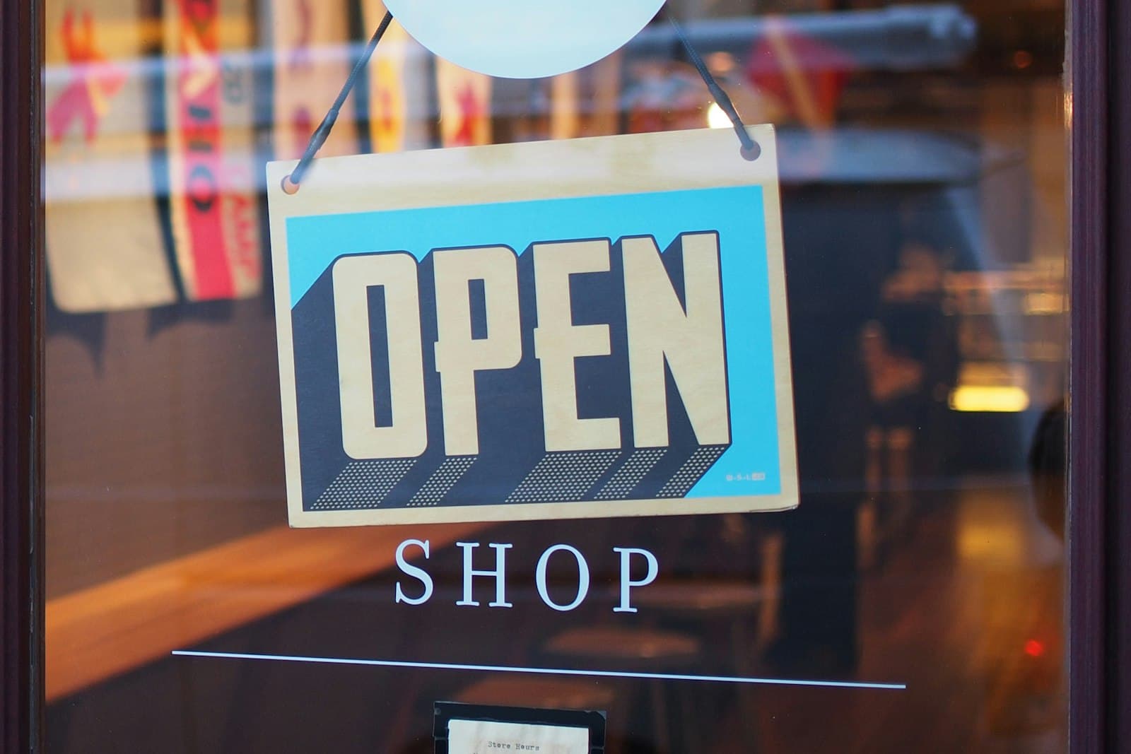 An 'Open' sign in a shop window